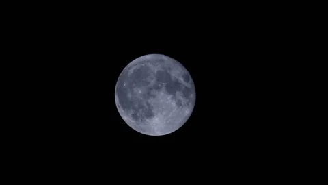 Full moon moving across the black sky on a dark night. Stock Footage 105200213