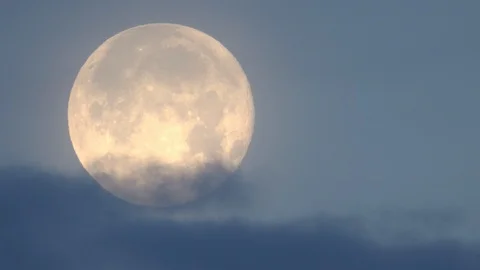 Full Moon moving through the sky behind clouds Stock Footage 101240046