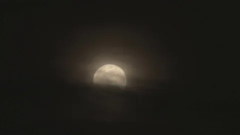 Full moon at night behind cloud Video stock 74073395