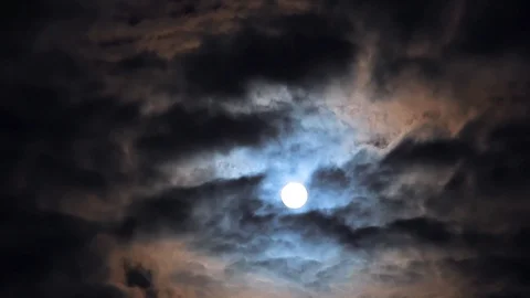 Full moon in night blue sky with fast moving clouds, dramatic mysterious Stock Footage 106842483