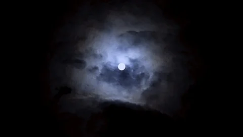 Full moon on night blue sky. Bright moon between volume clouds. Werewolves time. Stock Footage 108017343