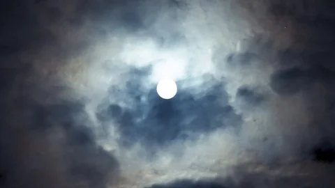 Full moon on night blue sky on cloudy day. Moon between clouds. Werewolves time. Stock Footage 108024188