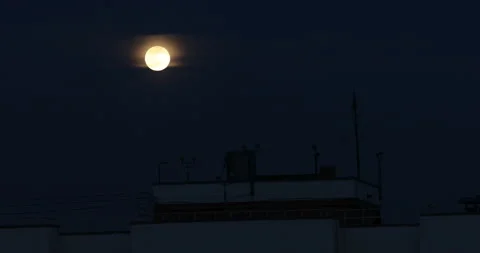 Full Moon At Night In The Clouds Beautiful Moon Over The Roof Stock Footage 126066821