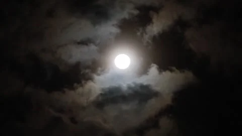 Full moon, at night, clouds moving slowly across the moon, dark night sky, real Stock Footage 346435195