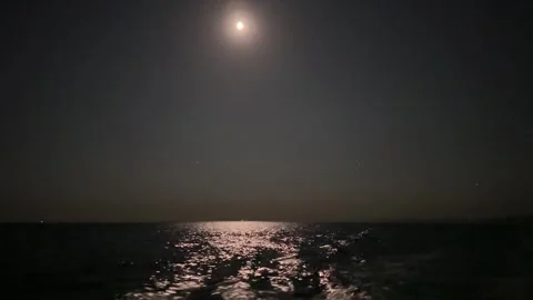 Full moon at night reflected in the water. Moonlight bright sea reflection. view Stock Footage 282431572