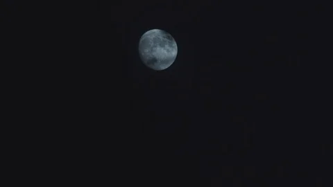 Full Moon at night, revealed by clouds Stock Footage 98010299