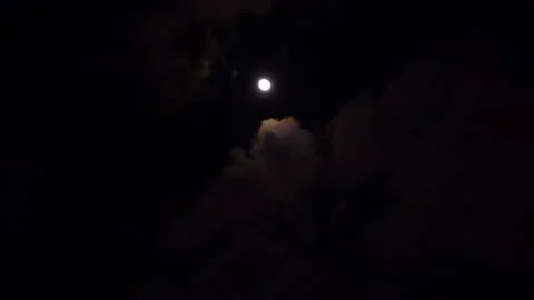 Full moon in the night sky above high-rise buildings illuminated by lanterns Stock Footage 296596964