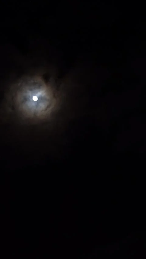 Full moon in the night sky above high-rise buildings illuminated by lanterns Stock Footage 296597287