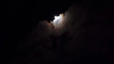 Full moon in the night sky above high-rise buildings illuminated by lanterns Stock Footage 296597288