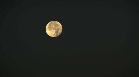 Full moon in the night sky an arc. A full moon is the lunar phase that occurs wh Stock Footage 69029378