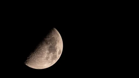 The full moon in the night sky is hidden in dark clouds. The Moon surrounded by Stock Footage 326037623