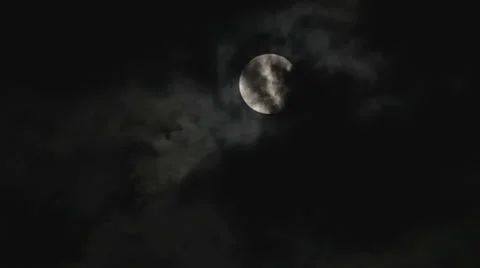 Full moon in the night sky over the trees and clouds Stock Footage 55744241