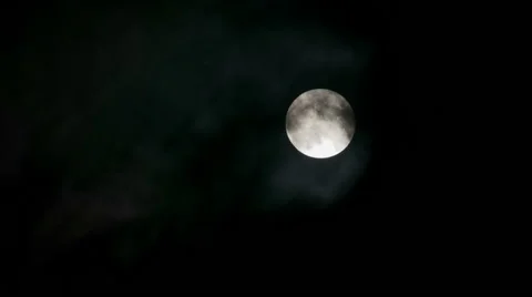 Full moon night, through the disk that are flying clouds Stock Footage 60563282
