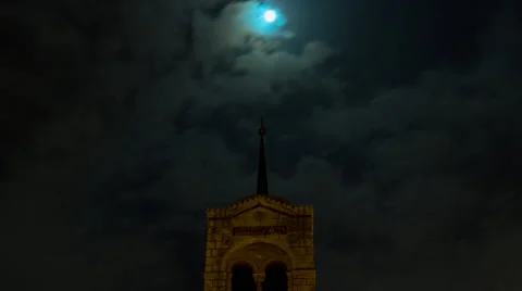 Full moon night timelapse over church steeple spire Stock Footage 49942947