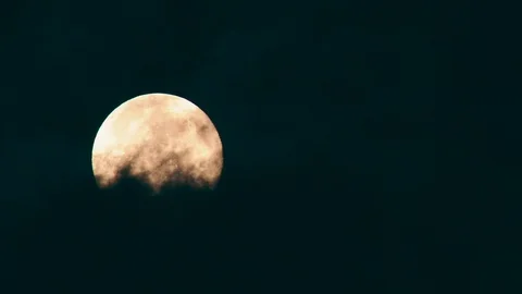 Full Moon obscured by dark clouds, Compton Abbas, Dorset, UK Video stock 128840564