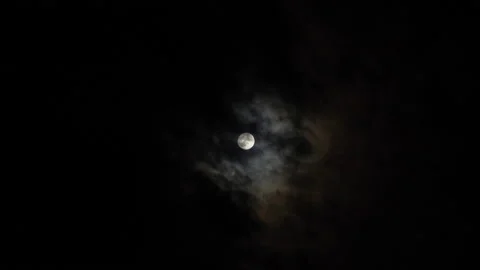The full moon obscured by dark spooky clouds Stock Footage 209101299