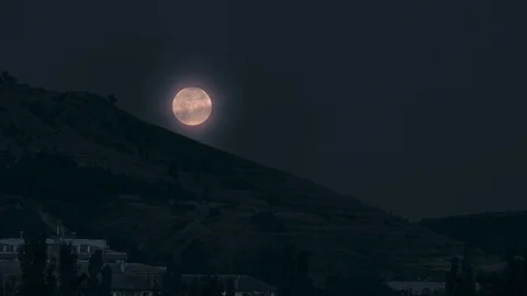 Full moon over the big mountain at night Stock Footage 126883985