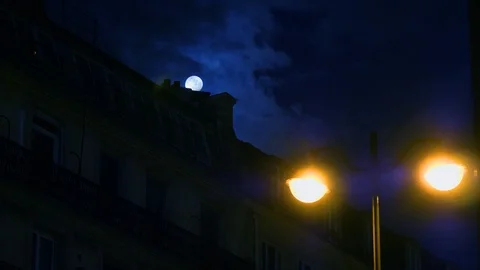 Full moon over Champs Elysees Paris France building home night Stock Footage 105815084