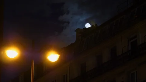 Full moon over Champs Elysees Paris France mansard roof Stock Footage 105815123