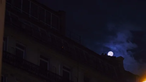 Full moon over Champs Elysees Paris France building home night Stock Footage 105815189
