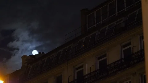 Full moon over Champs Elysees Paris France building home night Stock Footage 105815290
