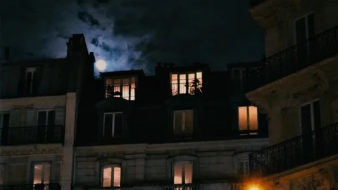 Full moon over Champs Elysees Paris France building illuminated windows Stock Footage 105815919