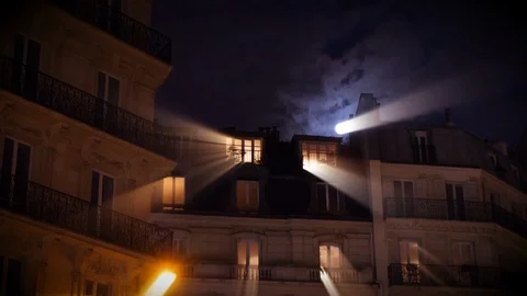 Full moon over Champs Elysees Paris France building home night iridiscent beams Stock Footage 105816201