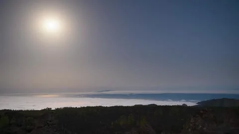 Full Moon Over Clouds and La Gomera Before Sunrise – 4K Timelapse Stock Footage 314216202