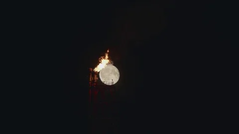 Full Moon over the gas flaring on the rig Stock Footage 84053438