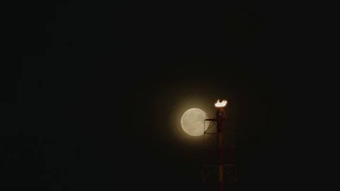 Full Moon over the gas flaring on the rig Stock Footage 84055159