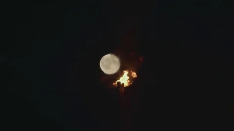 Full Moon over the gas flaring on the rig Stock Footage 84055860