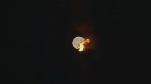 Full Moon over the gas flaring on the rig Stock Footage 84056112