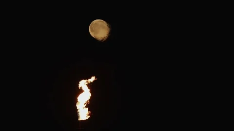 Full Moon over the gas flaring on the rig Stock Footage 84056775