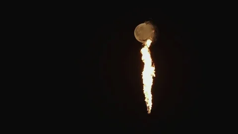 Full Moon over the gas flaring on the rig Stock Footage 84057115