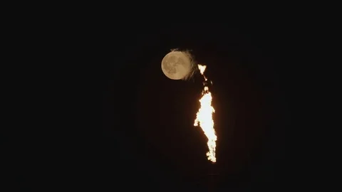 Full Moon over the gas flaring on the rig Stock Footage 84057742