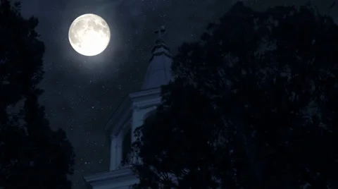 Full moon over an historical 1790 graveyard and church steeple Stock Footage 33400382