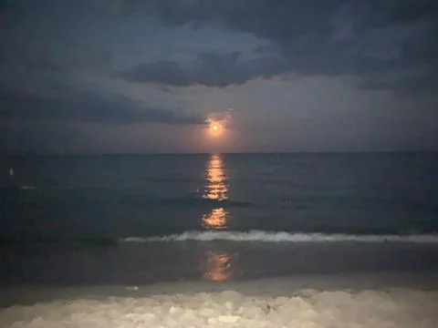 Full Moon Over the Sea with Reflection at Night Stock Photos