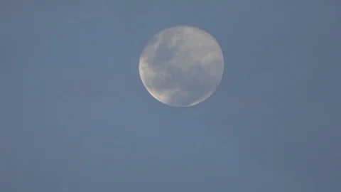 Full Moon Partially Obscured By Thin Clouds During Daylight Stock-Footage 106947808