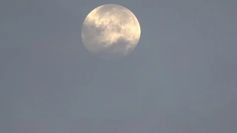 Full Moon Partially Obscured By Thin Clouds During Daylight Stock-Footage 106947841