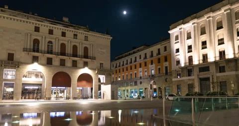 The full moon passes over the Italian square Stock Footage 138963421