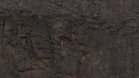 Full Moon Peeking Over Rugged Textured Desert Cliff Stock Footage 336025500