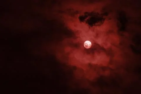 Full moon with red clouds in the night sky Stock Photos