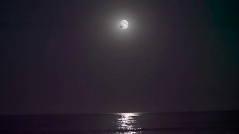 Full Moon Reflecting on Calm Ocean at Night Stock Footage 345096020