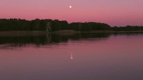 Full moon reflecting in a lake Stock Footage 70808540