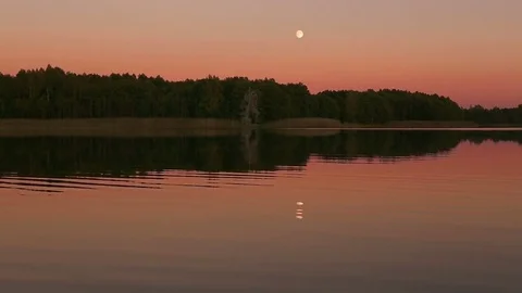 Full moon reflecting in a lake Stock Footage 71006513