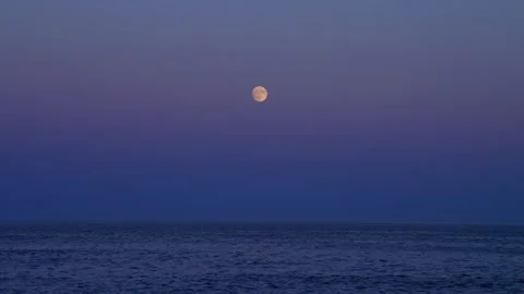 Full moon rise over the Atlantic from beach in Acadia National Park, Maine. Stock Footage 336295898