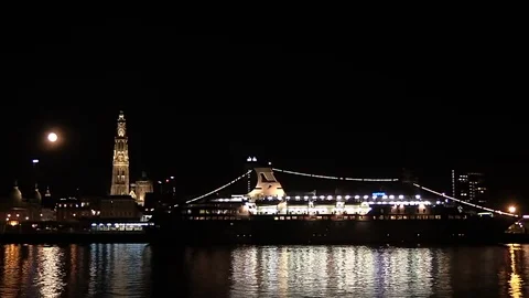 A full moon rise over Scheldt River and cathedral, Antwerp cityscape Stock Footage 99431601