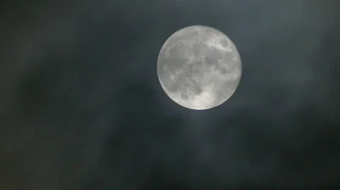 FULL MOON rise rising in the cloudy misty cloud sky at night Stock Footage