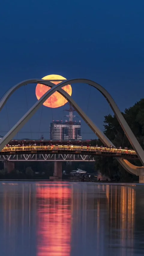 Full Moon rises behind of the pedestrian bridge Stock Footage 293159717