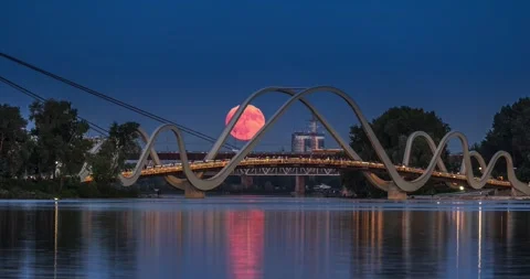 Full Moon rises behind of the pedestrian bridge Stock Footage 293159741